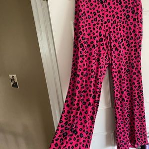 Cute animal print wide leg pants.. Bright pink with purple, black & white print.
